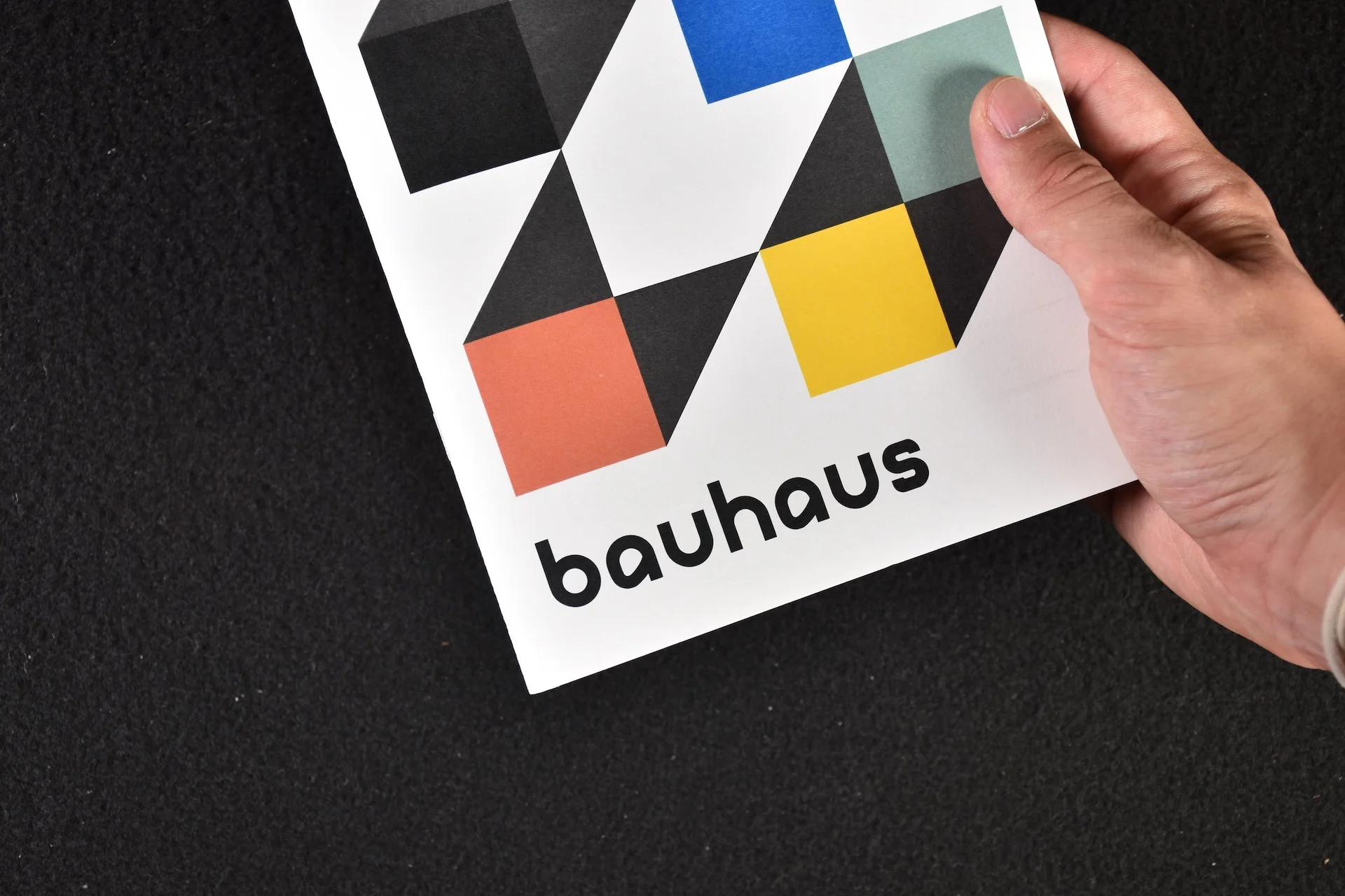Book cover of the Bauhaus research project, with a black background and a white square in the middle, containing the title of the project in a Bauhaus-inspired typeface